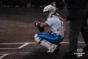 Creighton Bluejays Lily West checks her wrist during a college softball game against Seattle on March 21st, 2025 in Council Bluffs, Iowa. Photo by Brandon Tiedemann.