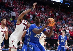 reighton Bluejay center Fredrick King (33) goes for a lay up against Louisville Cardinal forward James Scott (0) in the second half during the first round of the NCAA Men's Basketball Tournament Thursday, March 20, 2025, Lexington, Kentucky. Photo by Jeff Moreland.