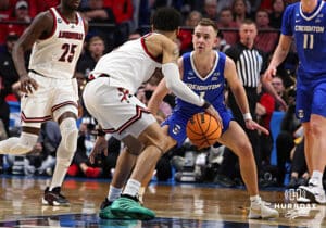 Creighton Bluejay guard Steven Ashworth (1) guards Louisville Cardinal guard J'Vonne Hadley (1) in the second half during the first round of the NCAA Men's Basketball Tournament Thursday, March 20, 2025, Lexington, Kentucky. Photo by Jeff Moreland.