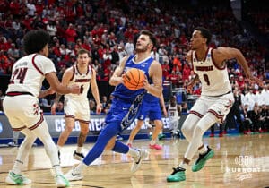Creighton Bluejay guard Fedor Zugic (7) drives to the basket against Louisville Cardinal guard Chucky Hepburn (24) in the second half during the first round of the NCAA Men's Basketball Tournament Thursday, March 20, 2025, Lexington, Kentucky. Photo by Jeff Moreland.