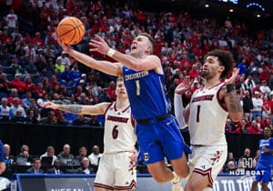 Creighton Bluejay guard Steven Ashworth (1) goes for a lay up against Louisville Cardinal guard J'Vonne Hadley (1) in the second half during the first round of the NCAA Men's Basketball Tournament Thursday, March 20, 2025, Lexington, Kentucky. Photo by Jeff Moreland.