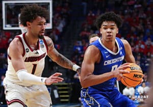 Creighton Bluejay forward Jasen Green (0) drives to the lane against Louisville Cardinal guard J'Vonne Hadley (1) in the first half during the first round of the NCAA Men's Basketball Tournament Thursday, March 20, 2025, Lexington, Kentucky. Photo by Jeff Moreland.