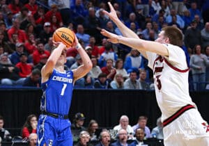 Creighton Bluejay guard Steven Ashworth (1) makes a three-point shot agianst Louisville Cardinal forward Noah Waterman (93) in the first half during the first round of the NCAA Men's Basketball Tournament Thursday, March 20, 2025, Lexington, Kentucky. Photo by Jeff Moreland.