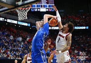 Creighton Bluejay center Ryan Kalkbrenner (11) attempts a dunk against Louisville Cardinal guard J'Vonne Hadley (1) in the first half during the first round of the NCAA Men's Basketball Tournament Thursday, March 20, 2025, Lexington, Kentucky. Photo by Jeff Moreland.
