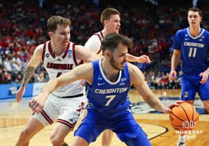 Creighton Bluejay guard Fedor Zugic (7) dribbles the ball against Louisville Cardinal guard Reyne Smith (6) in the first half during the first round of the NCAA Men's Basketball Tournament Thursday, March 20, 2025, Lexington, Kentucky. Photo by Jeff Moreland.