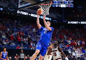 Creighton Bluejay center Ryan Kalkbrenner (11) makes a lay up against the Louisville Cardinas in the first half during the first round of the NCAA Men's Basketball Tournament Thursday, March 20, 2025, Lexington, Kentucky. Photo by Jeff Moreland.