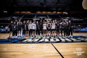 Omaha Mavericks pose for a group photo during open practice before the first round of the NCAA Basketball Tournament on Wednesday, March 19, 2025 in Providence, Rhode Island. Photo by Cassie Baker.