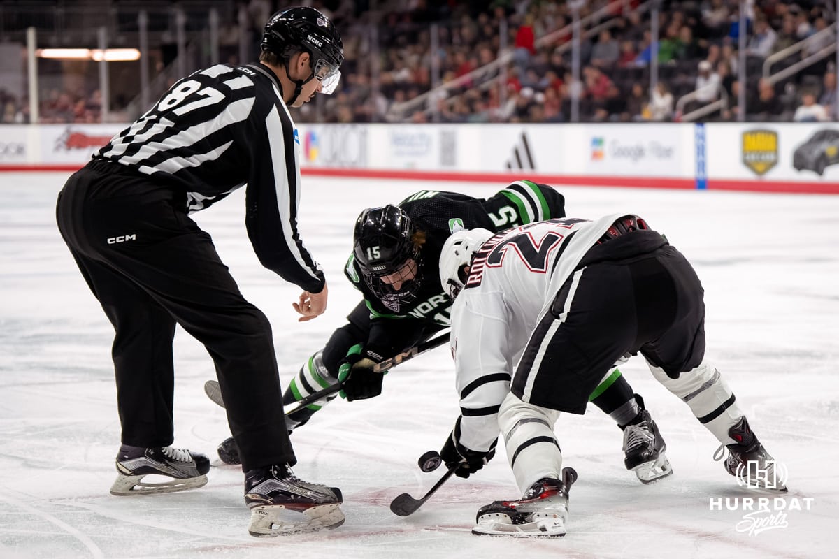 Omaha Mavericks vs North Dakota 2025-3-14 Omaha Mavericks Tyler Rollwagen faces off against North Dakota Carter Wilkie (15) during a college hockey match on March 14th, 2025, in Omaha, Nebraska. Photo by Brandon Tiedemann.
