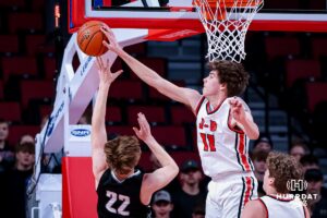 Johnson-Brock Eagle Brody Koehler (11) blocks a lay up against Elmood-Murdock KnightsBrody Marsh (22) during the quarter-finals of the NSAA Boys State Championships Wednesday, March 12, 2025. Photo by Mac Johnson.