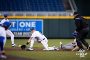 South Dakota State Jackrabbit outfielder Bryce Ronken (27) advanced to second on a wild pitch against Creighton Bluejay infielder Kyle Hess (15) in the sixth inning during a college baseball game Tuesday, March 18, 2025 in Omaha, Nebraska. Photo by John S. Peterson.