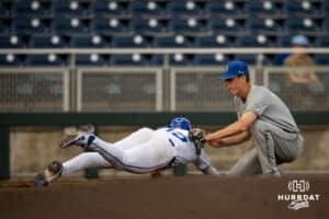 Creighton Bluejay infielder Kyle Hess (15) tagged out by South Dakota State Jackrabbit infielder Nolan Grawe (4) during a college baseball game Tuesday, March 18, 2025 in Omaha, Nebraska. Photo by John S. Peterson.