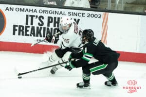 Omaha Mavericks Cameron Mitchell goes after the puck during a college hockey game against North Dakota on March 15th, 2025 in Omaha Nebraska. Photo by Brandon Tiedemann.