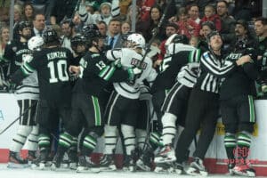 Omaha Mavericks get in a fight during a college hockey game against North Dakota on March 15th, 2025 in Omaha Nebraska. Photo by Brandon Tiedemann.