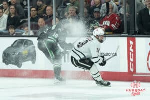Omaha Mavericks Myles Hilman goes after the puck during a college hockey game against North Dakota on March 15th, 2025 in Omaha Nebraska. Photo by Brandon Tiedemann.