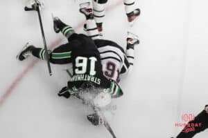 Omaha Mavericks Dylan Gratton fights an oppnent during a college hockey game against North Dakota on March 15th, 2025 in Omaha Nebraska. Photo by Brandon Tiedemann.