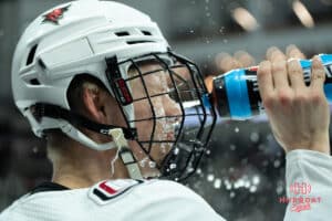 Omaha Mavericks Marcus Broberg sprays water on his face before a college hockey game against North Dakota on March 15th, 2025 in Omaha Nebraska. Photo by Brandon Tiedemann.