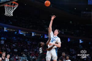 Creighton Bluejay center Ryan Kalkbrenner (11) makes a jump shot against Connecticut Husky center Samson Johnson (35) during the semi-final round in the Big East Tournament Friday, March 14, 2025, New York, New York. Photo by Jordan Arnold.