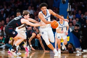 Creighton Bluejay forward Jasen Green (0) dribbles the ball in a fast break against Connecticut Husky forward Liam McNeeley (30) during the semi-final round in the Big East Tournament Friday, March 14, 2025, New York, New York. Photo by Jordan Arnold.
