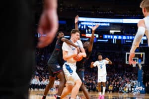 Creighton Bluejay center Ryan Kalkbrenner (11) fights for the ball against the Connecticut Huskies during the semi-final round in the Big East Tournament Friday, March 14, 2025, New York, New York. Photo by Jordan Arnold.