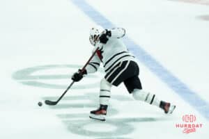 Omaha Mavericks Jacob Guevin shoots during a college hockey game against North Dakota on March 14th, 2025 in Omaha Nebraska. Photo by Brandon Tiedemann.