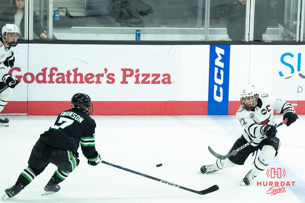 Omaha Mavericks Nolan Krenzen passes the puck during a college hockey game against North Dakota on March 14th, 2025 in Omaha Nebraska. Photo by Brandon Tiedemann.