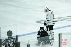Omaha Mavericks Sam Stange looks down at an oppnent during a college hockey game against North Dakota on March 14th, 2025 in Omaha Nebraska. Photo by Brandon Tiedemann.