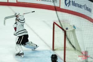 Omaha Mavericks Simon Latkoczy saves a shot during a college hockey game against North Dakota on March 14th, 2025 in Omaha Nebraska. Photo by Brandon Tiedemann.