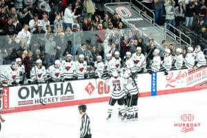 Omaha Mavericks celebrate a Jacob Guevin goal during a college hockey game against North Dakota on March 14th, 2025 in Omaha Nebraska. Photo by Brandon Tiedemann.