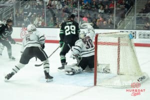 Omaha Mavericks Simon Latkoczy saves a shot during a college hockey game against North Dakota on March 14th, 2025 in Omaha Nebraska. Photo by Brandon Tiedemann.