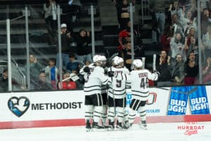 Omaha Mavericks celebrate a goal during a college hockey game against North Dakota on March 14th, 2025 in Omaha Nebraska. Photo by Brandon Tiedemann.