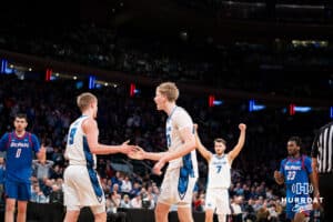 Creighton Bluejay forward Jackson McAndrew (23) gives Ty Davis five after getting fouled against the DePaul Blue Demons during the Big East Basketball Tournament, Thursday, March 14, 2025, in New York, New York. Photo by Jordan Arnold.
