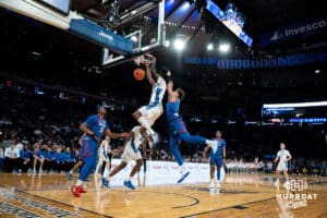 Creighton Bluejay guard Jamiya Neal (5) dunks the ball against DePaul Blue Demon guard Isaiah Rivera (1) during the Big East Basketball Tournament, Thursday, March 14, 2025, in New York, New York. Photo by Jordan Arnold.