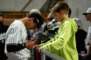 Omaha Maverick Henry Zipay signs autographs for the fans during a baseball game at Tal Anderson Field on March 12th, 2025 in Omaha Nebraska. Photo by Collin Stilen.