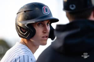 Omaha Maverick Jackson Trout listens to coach during a baseball game at Tal Anderson Field on March 12th, 2025 in Omaha Nebraska. Photo by Collin Stilen.