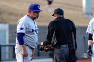 Kansas State Wildcat head coach Pete Hughes talks with the umpire during a baseball game at Tal Anderson Field on March 12th, 2025 in Omaha Nebraska. Photo by Collin Stilen.