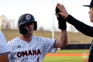 Omaha Maverick Henry Zipay celebrates a scoring run with the team during a baseball game at Tal Anderson Field on March 12th, 2025 in Omaha Nebraska. Photo by Collin Stilen.