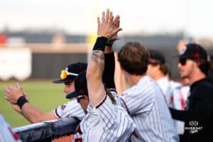 Omaha Mavericks are celebrating a hit during a baseball game at Tal Anderson Field on March 12th, 2025 in Omaha Nebraska. Photo by Collin Stilen.