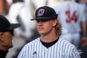 Omaha Maverick Landon Mueller listening to coach between innings during a baseball game at Tal Anderson Field on March 12th, 2025 in Omaha Nebraska. Photo by Collin Stilen.