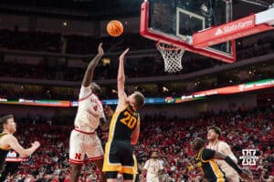 Nebraska Basketball player Juwan Gary shoots over Iowa opponent Payton Sandfort during a college basketball game on March 09, 2025 in Lincoln, Nebraska. Photo by Logan Hock.