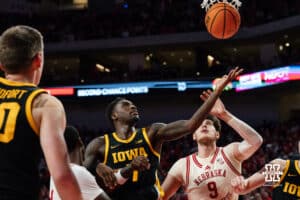 Nebraska Basketball player Berke Buyuktuncel and Iowa opponent Seydou Traore watch a made basket during a college basketball game on March 09, 2025 in Lincoln, Nebraska. Photo by Logan Hock.