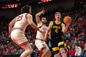 Nebraska Basketball players Andrew Morgan and Rollie Worster defend against Iowa opponent, Josh Dix, during a college basketball game on March 09, 2025 in Lincoln, Nebraska. Photo by Logan Hock.