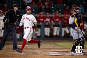 Nebraska Cornhusker Cayden Brumbaugh (0) scores in the saeventh inning against the Wichita St. Shockers during a college baseball game Tuesday, March 11, 2025 in Lincoln, Nebraska. Photo by John S. Peterson.