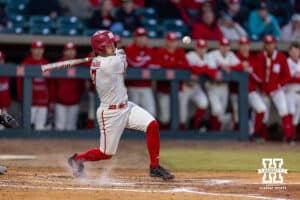 Nebraska Cornhusker Cayden Brumbaugh (0) singles in the fifth scoring Sanderson on a throwing error against the Wichita St. Shockers during a college baseball game Tuesday, March 11, 2025 in Lincoln, Nebraska. Photo by John S. Peterson.