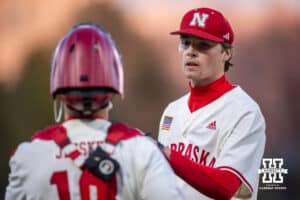 Nebraska Cornhusker pitcher Carson Jasa (39) get a fist bump from catcher Will Jesske before headign to the dugout in the fourth inning against the Wichita St. Shockers during a college baseball game Tuesday, March 11, 2025 in Lincoln, Nebraska. Photo by John S. Peterson.