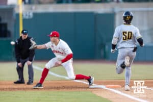 Nebraska Cornhusker first baseman Case Sanderson (14) makes an out at first against Wichita St. Shocker Kam Durnin (50) in the third inning during a college baseball game Tuesday, March 11, 2025 in Lincoln, Nebraska. Photo by John S. Peterson.