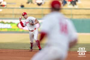 Nebraska Cornhusker shortstop Dylan Carey (15) throws to first base for an out against the Wichita St. Shockers in the second inning during a college baseball game Tuesday, March 11, 2025 in Lincoln, Nebraska. Photo by John S. Peterson.