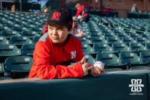 Nebraska Cornhuskers fan collecting autographs before the game against the Wichita St. Shockers during a college baseball game Tuesday, March 11, 2025 in Lincoln, Nebraska. Photo by John S. Peterson.