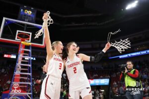 Pender's Madalyn Doliver (3) and Hadley Walsh (2) celebrate the win over Elm Creek for the NSAA Girls State Basketball Championship Saturday, March 8, 2025, in Lincoln, Nebraska. Photo by Mac Johnson.