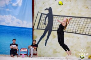 Nebraska Cornhusker Olivia Mauch (34) serves the ball against the Ottawa Braves during a college beach volleyball match Tuesday, March 4, 2025 in Lincoln, Nebraska. Photo by John S. Peterson.
