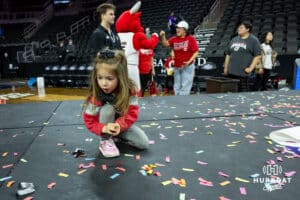 Omaha Maverick fans collects confetti after the win over St. Thomas Tommies during the Summit League Tournament Finals Sunday, March 9, 2025 in Sioux Falls, South Dakota. Photo by John S. Peterson.